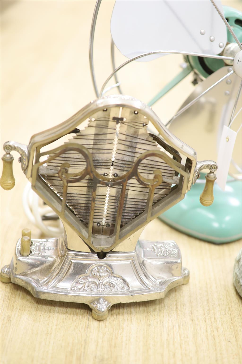 Early 20th century metal toaster and electric fan and lighthouse lamp and juicer